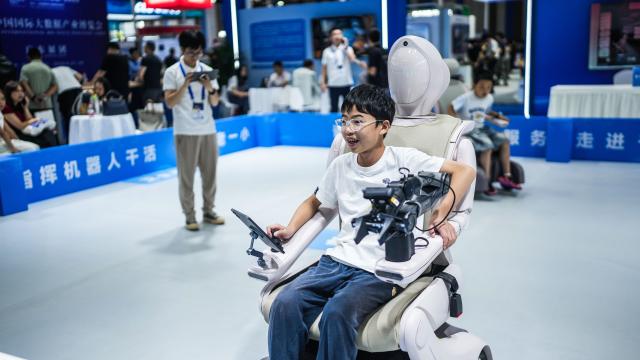 (260830) -- BEIJING, Aug. 30, 2026 (Xinhua) -- Children try smart robots for assisted mobility at the 2026 China International Big Data Industry Expo in Guiyang, southwest China's Guizhou Province, Aug. 28, 2026. The expo kicked off here on Friday, showcasing the cutting-edge technologies in several key sectors including computing power infrastructure, data supply, model-driven innovation, security safeguards, and intelligent experiences. (Xinhua/Tao Liang)