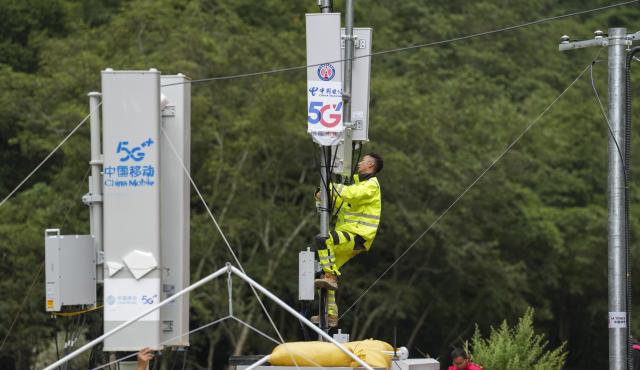 (260830) -- LHASA, Aug. 30, 2026 (Xinhua) -- A staff member works on a signal base station in Gyirong Town, southwest China's Xizang Autonomous Region, Aug. 29, 2026. A total of 2,141 rescuer personnel, 269 rescue vehicles and 3,922 sets of equipments have been deployed to the mudslide-hit areas so far to search for the missing, with rescue teams searching an area of about 90,000 square meters. (Xinhua/Jigme Dorje)