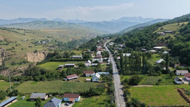 (260830) -- BISHKEK, Aug. 30, 2026 (Xinhua) -- An aerial drone photo taken on May 9, 2026 shows a village road repaired by a project department of the China-Kyrgyzstan-Uzbekistan railway in Jalalabad, Kyrgyzstan. The China-Kyrgyzstan-Uzbekistan railway is a flagship project of the Belt and Road Initiative, personally promoted by the heads of state of China, Kyrgyzstan and Uzbekistan.
  The route begins in Kashgar, located in northwest China's Xinjiang Uygur Autonomous Region, and passes through the mountainous terrain of Kyrgyzstan to reach Uzbekistan.
  It has become a strategic corridor benefiting all the three countries and their peoples, contributing to regional economic and social development and playing a significant role in promoting infrastructure connectivity, economic and trade exchanges, and high-quality development of the Belt and Road. (Photo by Ren Weiyun/Xinhua)