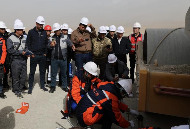 (260830) -- BISHKEK, Aug. 30, 2026 (Xinhua) -- Engineering and technical personnel from Kyrgyzstan and Uzbekistan learn from a Chinese construction team about subgrade construction in Naryn Oblast, Kyrgyzstan, Sept. 18, 2025. The China-Kyrgyzstan-Uzbekistan railway is a flagship project of the Belt and Road Initiative, personally promoted by the heads of state of China, Kyrgyzstan and Uzbekistan.
  The route begins in Kashgar, located in northwest China's Xinjiang Uygur Autonomous Region, and passes through the mountainous terrain of Kyrgyzstan to reach Uzbekistan.
  It has become a strategic corridor benefiting all the three countries and their peoples, contributing to regional economic and social development and playing a significant role in promoting infrastructure connectivity, economic and trade exchanges, and high-quality development of the Belt and Road. (Photo by Ren Weiyun/Xinhua)