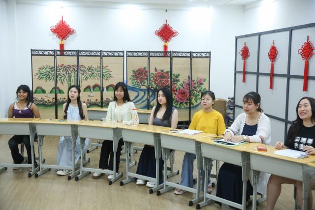 (260830) -- YANGON, Aug. 30, 2026 (Xinhua) -- Local students attend a Chinese singing class at the China Cultural Center in Yangon, Aug. 28, 2026. TO GO WITH "Asia-Pacific Community: A Myanmar vocal coach orchestrates harmonies beyond borders" (Xinhua/Myo Kyaw Soe)