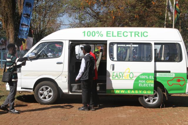 (260830) -- HARARE, Aug. 30, 2026 (Xinhua) -- Visitors look at an electric vehicle on display at the Zimbabwe Agricultural Show in Harare, Zimbabwe, Aug. 28, 2026. TO GO WITH "Zimbabwe's e-mobility drive gains traction with Chinese EVs" (Photo by Tafara Mugwara/Xinhua)