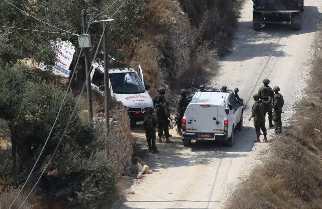 (260830) -- NABLUS, Aug. 30, 2026 (Xinhua) -- Israeli forces are seen outside a Palestinian home, in the Ras al-Ain area of Qusra village, south of Nablus in the West Bank, on Aug. 29, 2026. Multiple Palestinians were injured on Saturday in attacks by Israeli settlers across the West Bank, local reports and the Israeli military said. (Photo by Nidal Eshtayeh/Xinhua)