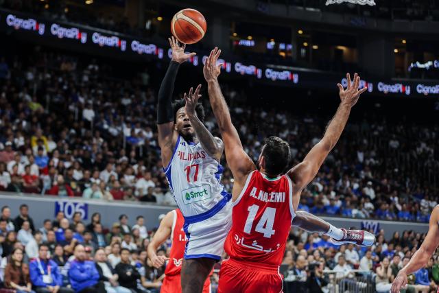 (260830) -- PASAY CITY, Aug. 30, 2026 (Xinhua) -- CJ Perez (L) of the Philippines competes during their second round match between the Philippines and Iran at the FIBA Basketball World Cup 2027 Asian Qualifiers in Pasay City, the Philippines, on Aug. 30, 2026. (Xinhua/Rouelle Umali)