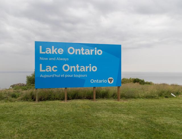 (260830) -- HAMILTON, Aug. 30, 2026 (Xinhua) -- An English-French bilingual sign reading "Lake Ontario Now and Always" is pictured at a lakeside conservation area in Hamilton, Ontario, Canada, on Aug. 30, 2026. Canadian Prime Minister Mark Carney said Thursday that the name "Lake Ontario" carries a long history and that Canadians will always use this name regardless of external changes.
  The Canadian prime minister made the remarks after U.S. President Donald Trump signed an executive order earlier on Thursday, directing the Department of the Interior to rename the lake "Lake America," as trade tensions between the United States and Canada have been escalating. (Photo by Zou Zheng/Xinhua)