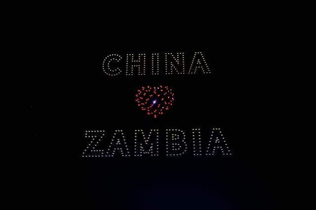 (260830) -- LUSAKA, Aug. 30, 2026 (Xinhua) -- A formation of drones depicts an image themed on China-Zambia friendship at a drone light show marking China-Zambia people-to-people exchanges in Lusaka, Zambia, on Aug. 29, 2026. Hundreds of synchronized drones on Saturday night lit up the skies of Lusaka, the Zambian capital, to mark the China-Zambia people-to-people exchanges.
  The drone light show featured a series of aerial visuals depicting landmark projects including the Tanzania-Zambia Railway, national flags of the two countries, and some of Zambia's unique tourism attractions. (Photo by Martin Mbangweta/Xinhua)