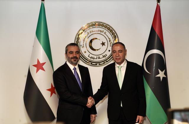 (260831) -- TRIPOLI, Aug. 31, 2026 (Xinhua) -- Libyan Acting Foreign Minister Taher Al-Baour (R) meets with visiting Syrian foreign affairs chief Asaad Hassan al-Shibani in Tripoli, Libya, Aug. 30, 2026. Al-Baour on Sunday met with al-Shibani in Tripoli to discuss bilateral relations, according to the Libyan Foreign Ministry. (Photo by Hazem Turkia/Xinhua)