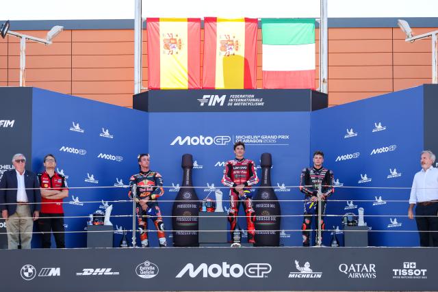 (260831) -- ALCANIZ, Aug. 31, 2026 (Xinhua) -- Ducati Lenovo Team's Marc Marquez (3rd R) of Spain, Red Bull KTM's Pedro Acosta (3rd L) of Spain and Aprilia Racing's Marco Bezzecchi (2nd R) of Italy react on the podium after the race of the MotoGP Aragon Grand Prix 2026 at Motorland Aragon Circuit, Alcaniz, Spain, Aug. 30, 2026. (Photo by Qian Jun/Xinhua)