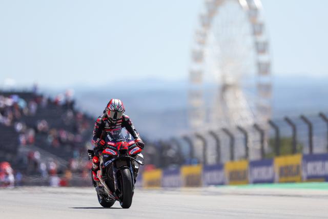 (260831) -- ALCANIZ, Aug. 31, 2026 (Xinhua) -- Aprilia Racing's Marco Bezzecchi of Italy warms up before the race of the MotoGP Aragon Grand Prix 2026 at Motorland Aragon Circuit, Alcaniz, Spain, Aug. 30, 2026. (Photo by Qian Jun/Xinhua)