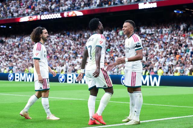 (260831) -- MADRID, Aug. 31, 2026 (Xinhua) -- Real Madrid's Kylian Mbappe celebrates his score with teammates during a La Liga football match between Real Madrid and Malaga CF at Santiago Bernabeu stadium in Madrid, Spain, on Aug. 30, 2026. (Photo by Gustavo Valiente/Xinhua)
