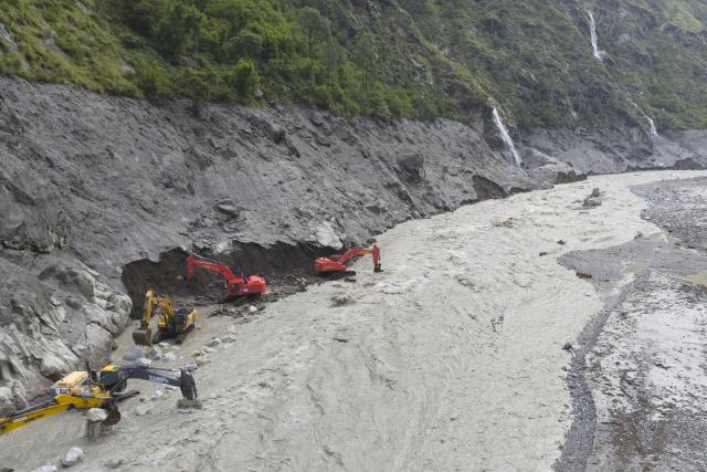 (260831) -- GYIRONG, Aug. 31, 2026 (Xinhua) -- This aerial drone photo shows excavators repairing a section of national highway G216 in Gyirong County, southwest China's Xizang Autonomous Region, on Aug. 31, 2026.
  Rescuers with China Anneng are carrying out clearing and restoration operations on the damaged road sections, striving to restore the vital access route to Gyirong Port. (Xinhua/Jiang Fan)