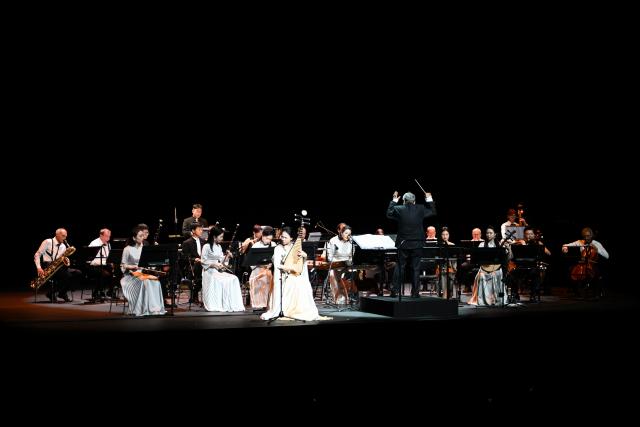 (260831) -- GENEVA, Aug. 31, 2026 (Xinhua) -- Musicians perform at the Chinese folk music concert "A Panorama of Hunan" in Geneva, Switzerland, Aug. 30, 2026. The Chinese folk music concert "A Panorama of Hunan" made its debut on its five-country European tour here on Sunday. (Xinhua/Lian Yi)