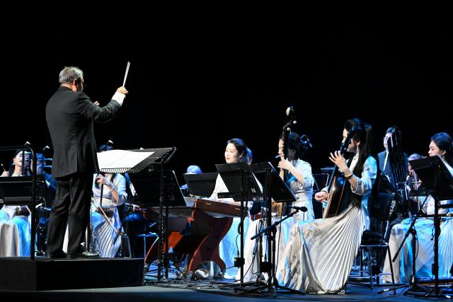 (260831) -- GENEVA, Aug. 31, 2026 (Xinhua) -- Musicians perform at the Chinese folk music concert "A Panorama of Hunan" in Geneva, Switzerland, Aug. 30, 2026. The Chinese folk music concert "A Panorama of Hunan" made its debut on its five-country European tour here on Sunday. (Xinhua/Lian Yi)