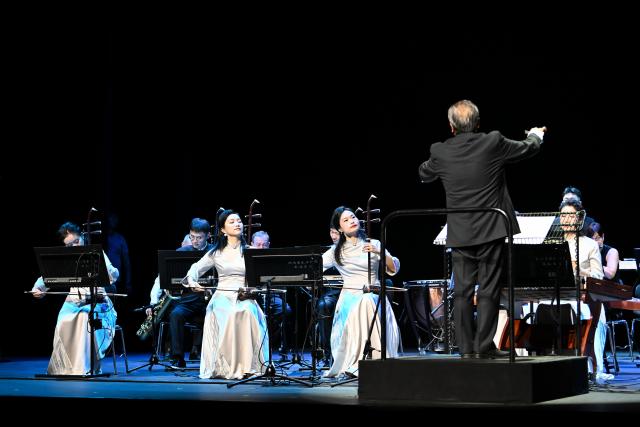 (260831) -- GENEVA, Aug. 31, 2026 (Xinhua) -- Musicians perform at the Chinese folk music concert "A Panorama of Hunan" in Geneva, Switzerland, Aug. 30, 2026. The Chinese folk music concert "A Panorama of Hunan" made its debut on its five-country European tour here on Sunday. (Xinhua/Lian Yi)