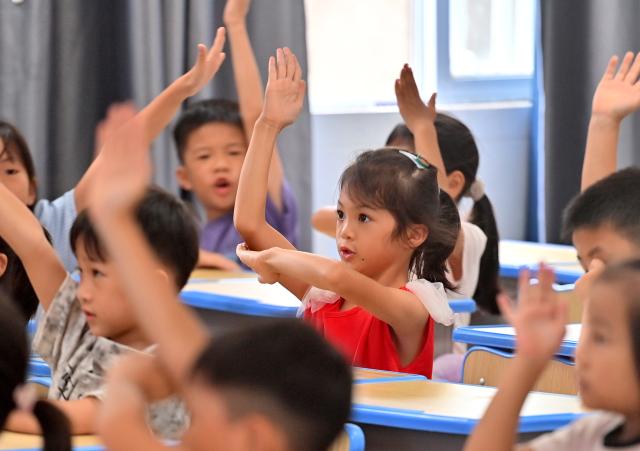 (260831) -- HENGZHOU, Aug. 31, 2026 (Xinhua) -- Students attend a class on the first day of the new semester at a school in Yunbiao Town of Hengzhou, south China's Guangxi Zhuang Autonomous Region, Aug. 31, 2026. A new semester kicked off for primary and secondary schools in Hengzhou on Monday. 
   Hengzhou suffered severe flooding triggered by Typhoon Maysak in July this year. After cleanup, repair, and disinfection, all the flood-affected schools started the new semester. (Xinhua/Huang Xiaobang)