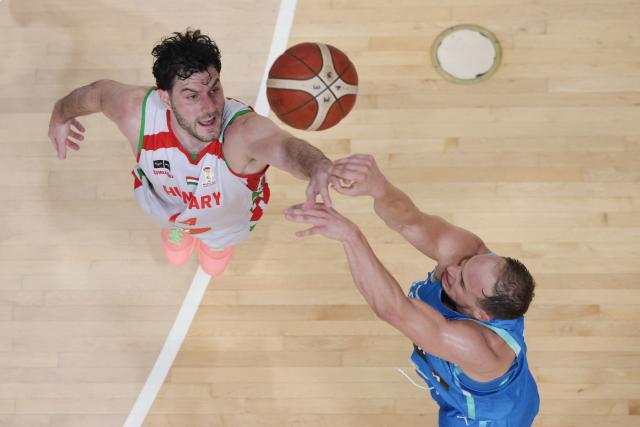 (260831) -- LJUBLJANA, Aug. 31, 2026 (Xinhua) -- Gyorgy Goloman(L) of Hungary competes during the men's FIBA Basketball World Cup 2027 European Qualifiers match between Slovenia and Hungary at Tivoli Sports Hall in Ljubljana, Slovenia, Aug. 30, 2026. (Photo by Zeljko Stevanic/Xinhua)