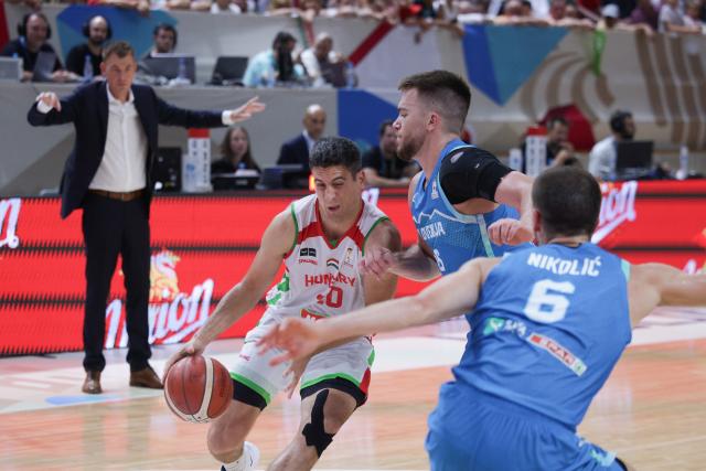 (260831) -- LJUBLJANA, Aug. 31, 2026 (Xinhua) -- Zoltan Perl (L) of Hungary vies with Tibor Mirtic (R) of Slovenia during the men's FIBA Basketball World Cup 2027 European Qualifiers match between Slovenia and Hungary at Tivoli Sports Hall in Ljubljana, Slovenia, Aug. 30, 2026. (Photo by Zeljko Stevanic/Xinhua)