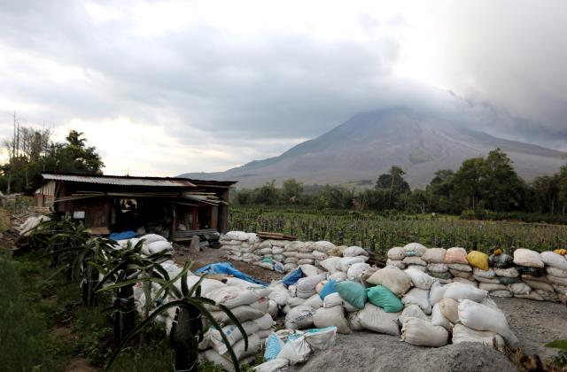 (260831) -- NORTH SUMATRA, Aug. 31, 2026 (Xinhua) -- Volcanic materials are seen spewing from Mount Sinabung in North Sumatra Province, Indonesia, Aug. 31, 2026. Mount Sinabung in Indonesia's North Sumatra province erupted Monday morning, sending volcanic ash over the nearby city of Berastagi, a local monitoring official said. (Photo by Adiva Niki/Xinhua)