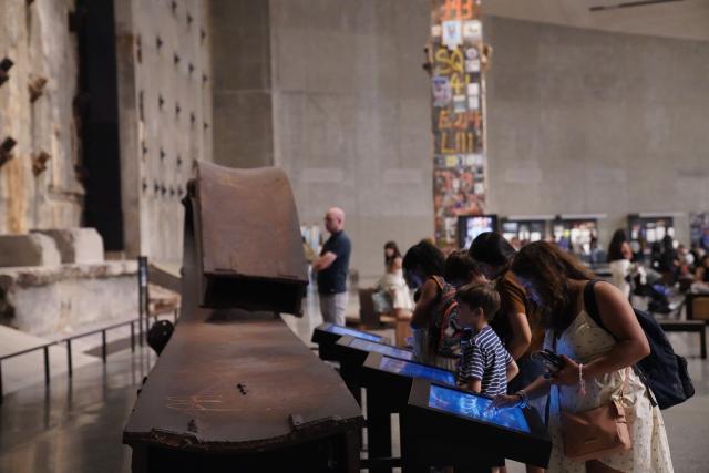 (260901) -- NEW YORK, Sept. 1, 2026 (Xinhua) -- People view an exhibit at the National September 11 Memorial & Museum in New York, the United States, on Aug. 31, 2026. A preview of an exhibition marking the 25th anniversary of the 9/11 attacks was held here on Monday. (Xinhua/Zhang Fengguo)