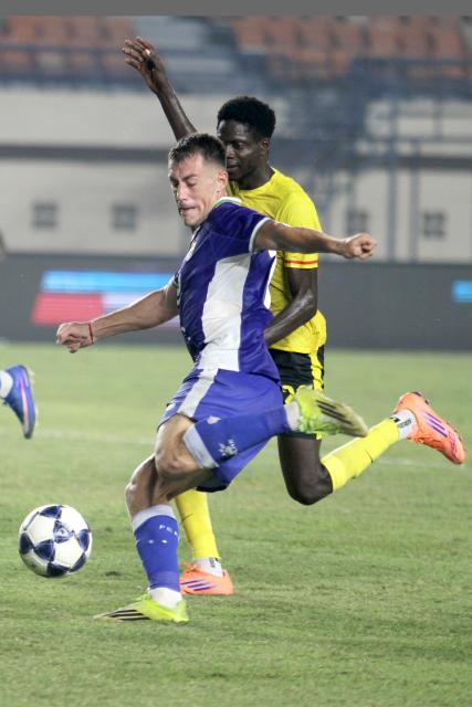(260901) -- BANDUNG, Sept. 1, 2026 (Xinhua) -- Mariano Peralta Bauer (front) of Persib Bandung kicks the ball during the AFC Champions League Two preliminary stage football match between Persib Bandung of Indonesia and Manila Diggers FC of the Philippines in Bandung, Indonesia, Aug. 31, 2026. (Photo by Septianjar Muharam/Xinhua)