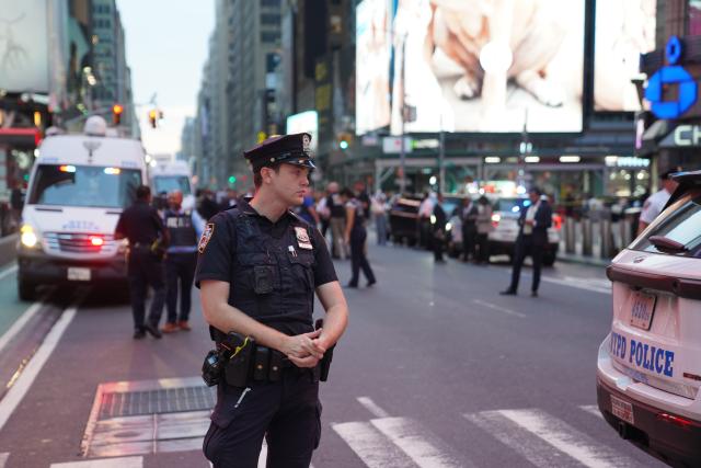 (260901) -- NEW YORK, Sept. 1, 2026 (Xinhua) -- A policeman works at the site of a stabbing attack in New York City, the United States, on Aug. 31, 2026. A person was killed, and another was injured in a stabbing by a woman armed with knives near Times Square in New York City on Monday afternoon, authorities said. (Xinhua/Zhang Fengguo)