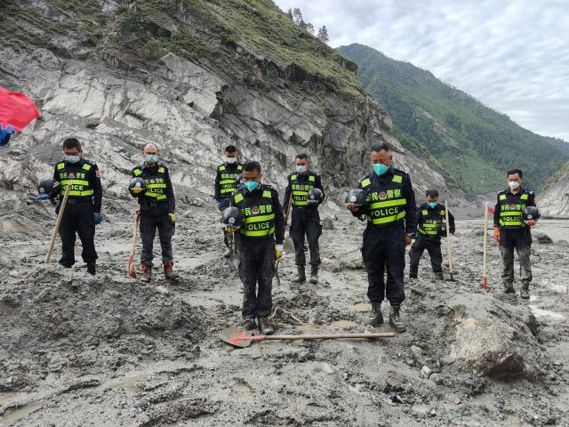(260901) -- GYIRONG, Sept. 1, 2026 (Xinhua) -- Rescuers observe a moment of silence for the victims of the Aug. 26 mudslide near the Gyirong Port in Gyirong County, southwest China's Xizang Autonomous Region, Sept. 1, 2026. Memorial services were held on Tuesday morning in Gyirong County, southwest China's Xizang Autonomous Region, to mourn the victims of the Aug. 26 mudslide that caused heavy casualties and left many missing. (Xinhua/Jigme Dorje)