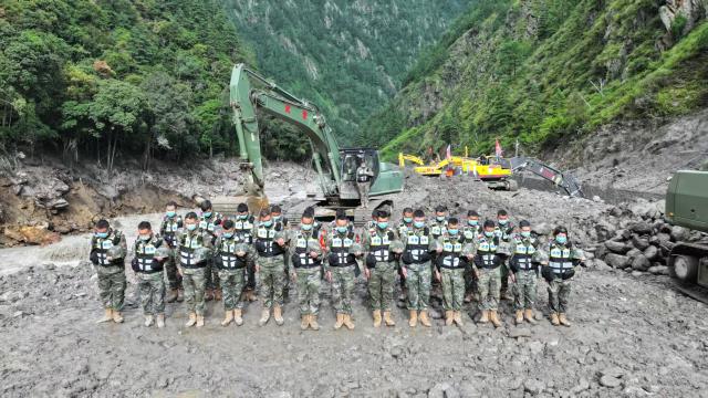 (260901) -- GYIRONG, Sept. 1, 2026 (Xinhua) -- Rescuers observe a moment of silence for the victims of the Aug. 26 mudslide at the rescue site in Gyirong County, southwest China's Xizang Autonomous Region, Sept. 1, 2026. Memorial services were held on Tuesday morning in Gyirong County, southwest China's Xizang Autonomous Region, to mourn the victims of the Aug. 26 mudslide that caused heavy casualties and left many missing. (Photo by Lu Wenkai/Xinhua)