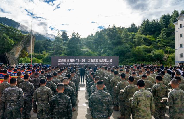 (260901) -- GYIRONG, Sept. 1, 2026 (Xinhua) -- A memorial service for the victims of the Aug. 26 mudslide is held at the Gyirong Port Branch of the Xigaze Public Security Bureau in Gyirong County, southwest China's Xizang Autonomous Region, Sept. 1, 2026. Memorial services were held on Tuesday morning in Gyirong County, southwest China's Xizang Autonomous Region, to mourn the victims of the Aug. 26 mudslide that caused heavy casualties and left many missing. (Xinhua/Tenzin Nyida)