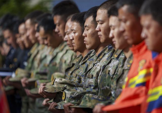 (260901) -- GYIRONG, Sept. 1, 2026 (Xinhua) -- A memorial service for the victims of the Aug. 26 mudslide is held at the Gyirong Port Branch of the Xigaze Public Security Bureau in Gyirong County, southwest China's Xizang Autonomous Region, Sept. 1, 2026. Memorial services were held on Tuesday morning in Gyirong County, southwest China's Xizang Autonomous Region, to mourn the victims of the Aug. 26 mudslide that caused heavy casualties and left many missing. (Xinhua/Tenzin Nyida)