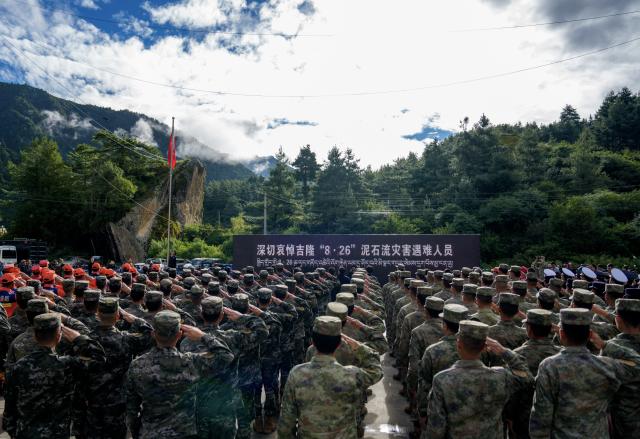 (260901) -- GYIRONG, Sept. 1, 2026 (Xinhua) -- A memorial service for the victims of the Aug. 26 mudslide is held at the Gyirong Port Branch of the Xigaze Public Security Bureau in Gyirong County, southwest China's Xizang Autonomous Region, Sept. 1, 2026. Memorial services were held on Tuesday morning in Gyirong County, southwest China's Xizang Autonomous Region, to mourn the victims of the Aug. 26 mudslide that caused heavy casualties and left many missing. (Xinhua/Tenzin Nyida)