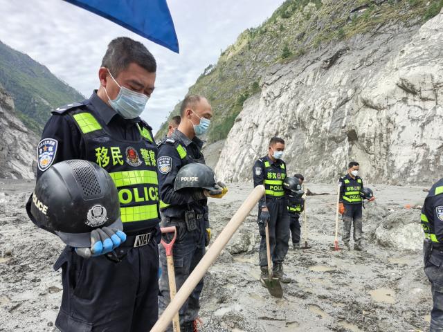 (260901) -- GYIRONG, Sept. 1, 2026 (Xinhua) -- Rescuers observe a moment of silence for the victims of the Aug. 26 mudslide near the Gyirong Port in Gyirong County, southwest China's Xizang Autonomous Region, Sept. 1, 2026. Memorial services were held on Tuesday morning in Gyirong County, southwest China's Xizang Autonomous Region, to mourn the victims of the Aug. 26 mudslide that caused heavy casualties and left many missing. (Xinhua/Jigme Dorje)
