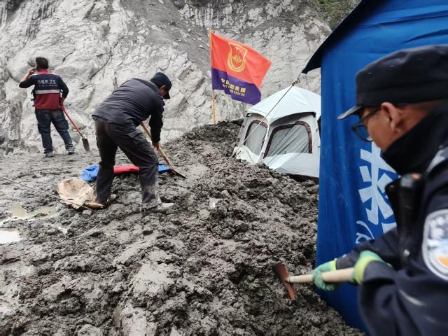 (260901) -- GYIRONG, Sept. 1, 2026 (Xinhua) -- Rescuers set up tents before nightfall in Gyirong County, southwest China's Xizang Autonomous Region, Aug. 31, 2026. Despite difficulties such as high-altitude terrain, steep valleys and volatile weather, the rescue forces have been working around the clock to search for survivors, repair roads, set up communication base stations and restore power lines. (Xinhua/Jigme Dorje)
