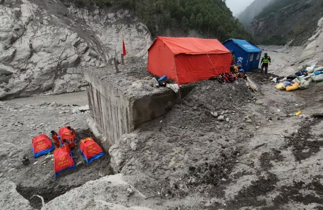 (260901) -- GYIRONG, Sept. 1, 2026 (Xinhua) -- Rescuers set up tents in Gyirong County, southwest China's Xizang Autonomous Region, Aug. 31, 2026. Despite difficulties such as high-altitude terrain, steep valleys and volatile weather, the rescue forces have been working around the clock to search for survivors, repair roads, set up communication base stations and restore power lines. (Xinhua/Jigme Dorje)