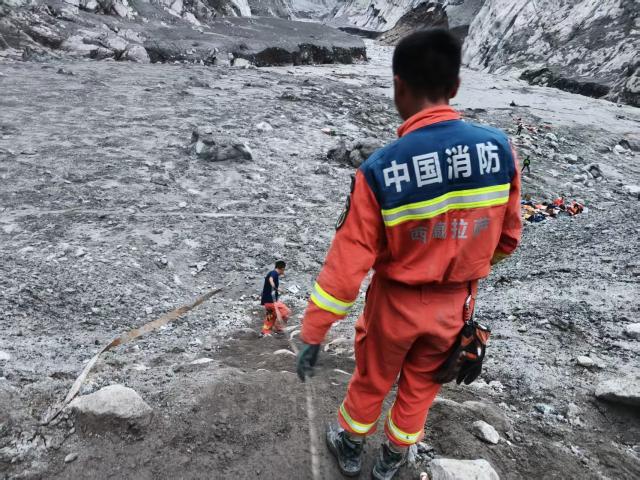 (260901) -- GYIRONG, Sept. 1, 2026 (Xinhua) -- Rescuers carry out search and rescue operations before nightfall in Gyirong County, southwest China's Xizang Autonomous Region, Aug. 31, 2026. Despite difficulties such as high-altitude terrain, steep valleys and volatile weather, the rescue forces have been working around the clock to search for survivors, repair roads, set up communication base stations and restore power lines. (Xinhua/Jigme Dorje)