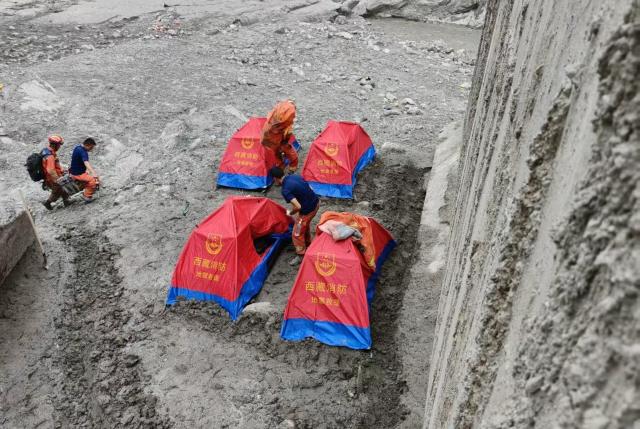 (260901) -- GYIRONG, Sept. 1, 2026 (Xinhua) -- Rescuers set up tents before nightfall in Gyirong County, southwest China's Xizang Autonomous Region, Aug. 31, 2026. Despite difficulties such as high-altitude terrain, steep valleys and volatile weather, the rescue forces have been working around the clock to search for survivors, repair roads, set up communication base stations and restore power lines. (Xinhua/Jigme Dorje)