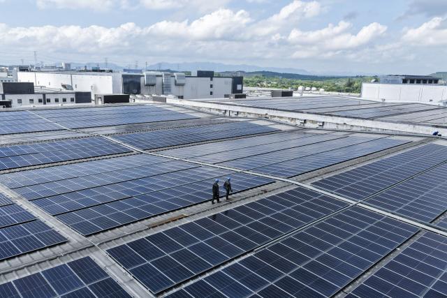 (260901) -- BEIJING, Sept. 1, 2026 (Xinhua) -- A drone photo taken on Aug. 25, 2026 shows the rooftop photovoltaic devices of a company in Huzhou City, east China's Zhejiang Province. China's installed photovoltaic (PV) power capacity surpassed coal-fired power capacity for the first time, making PV the country's largest power source by installed capacity, the National Energy Administration said Tuesday.
  China's installed PV power capacity reached 1.286 billion kilowatts at the end of July, according to the administration. (Xinhua/Xu Yu)