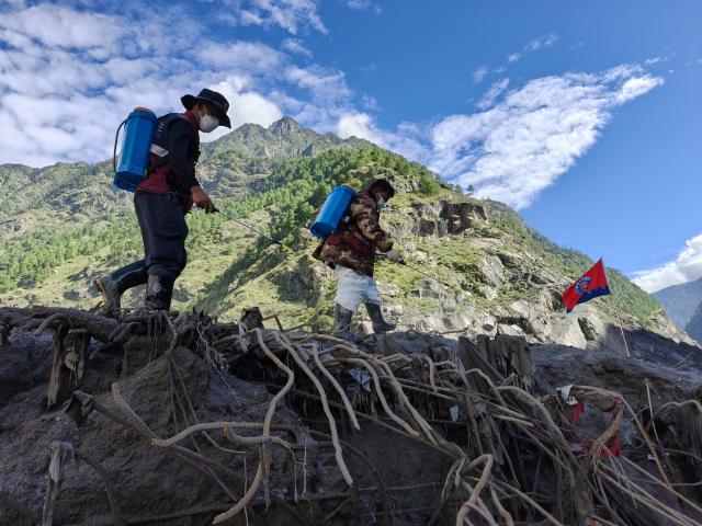 (260901) -- GYIRONG, Sept. 1, 2026 (Xinhua) -- Health workers carry out disinfection operations at the mudslide-hit Gyirong Port in Gyirong County, southwest China's Xizang Autonomous Region, Sept. 1, 2026. (Xinhua/Jigme Dorje)