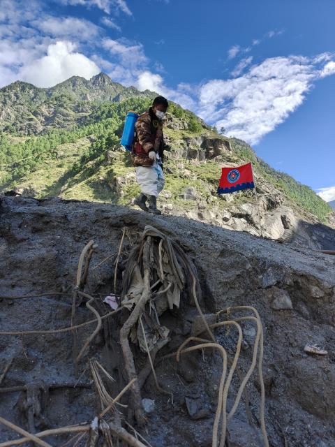 (260901) -- GYIRONG, Sept. 1, 2026 (Xinhua) -- A health worker carries out disinfection operations at the mudslide-hit Gyirong Port in Gyirong County, southwest China's Xizang Autonomous Region, Sept. 1, 2026. (Xinhua/Jigme Dorje)