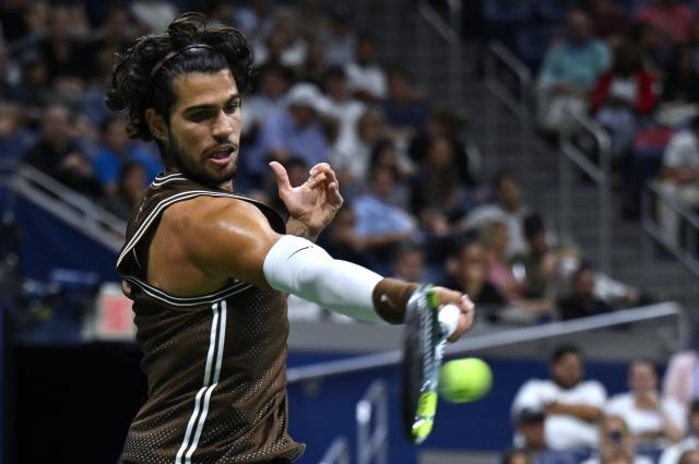 (260903) -- NEW YORK, Sept. 3, 2026 (Xinhua) -- Carlos Alcaraz reutrns a shot during the men's singles second round match between Carlos Alcaraz of Spain and Jaime Faria of Portugal at the 2026 US Open tennis championships in New York, the United States, Sept. 2, 2026. (Xinhua/Li Rui)