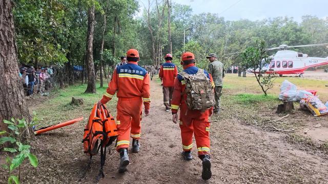 (260903) -- KATHMANDU, Sept. 3, 2026 (Xinhua) -- This screenshot from a video clip taken on Aug. 31, 2026 shows Chinese tunnel rescue experts and Nepalese rescuers returning from a search mission at a rescue command center in Nuwakot District, Nepal.
  TO GO WITH "Feature: Braving chest-deep mud, Chinese rescue team races to find survivors in mudslide-hit Nepal" (Xinhua/Zhao Manjun)