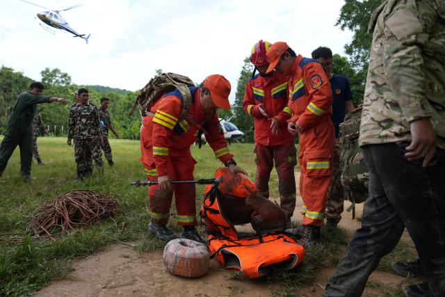 (260903) -- KATHMANDU, Sept. 3, 2026 (Xinhua) -- Chinese tunnel rescue experts return from a search mission at a rescue command center in Nuwakot District, Nepal, Aug. 31, 2026.
  TO GO WITH "Feature: Braving chest-deep mud, Chinese rescue team races to find survivors in mudslide-hit Nepal" (Xinhua/Liu Tian)