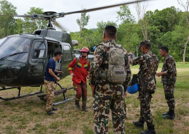(260903) -- KATHMANDU, Sept. 3, 2026 (Xinhua) -- Chinese tunnel rescue experts and Nepalese rescuers return from a search mission at a rescue command center in Nuwakot District, Nepal, Aug. 31, 2026.
  TO GO WITH "Feature: Braving chest-deep mud, Chinese rescue team races to find survivors in mudslide-hit Nepal" (Xinhua/Liu Tian)