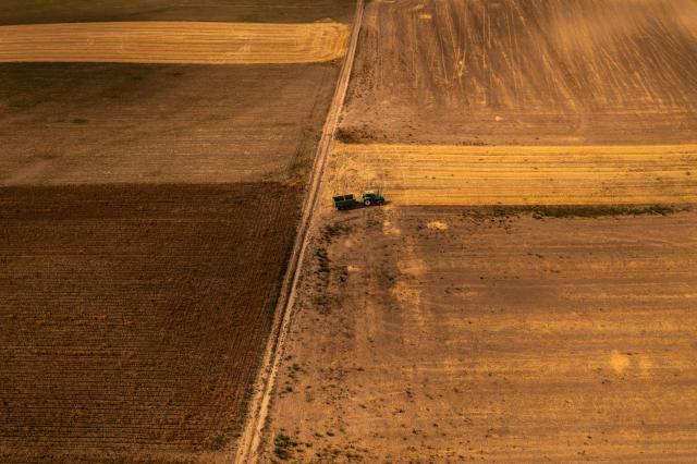 (260903) -- TINNYE, Sept. 3, 2026 (Xinhua) -- An aerial drone photo taken on Sept. 2, 2026 shows a tractor operating at a grain field near Tinnye, Hungary.
  August 2026 was the hottest month recorded in Hungary since 1901, with the nationwide average temperature reaching 24.9 degrees Celsius, the country's meteorological service HungaroMet said on Wednesday.
  The prolonged drought has weighed on agriculture. Data released by the Hungarian Central Statistical Office on Tuesday showed that the value added of agriculture fell 12.4 percent year on year in the second quarter due to severe drought. (Photo by David Balogh/Xinhua)