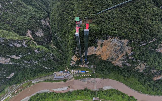 (260903) -- KUNMING, Sept. 3, 2026 (Xinhua) -- An aerial drone photo taken on Aug. 29, 2026 shows cliffside elevators at the Nizhu River Grand Canyon in Puli Township, Xuanwei City, southwest China's Yunnan Province. (Xinhua/Chen Xinbo)