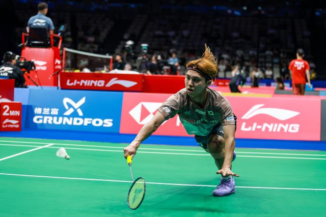 (260903) -- SHENZHEN, Sept. 3, 2026 (Xinhua) -- Naraoka Kodai hits a return during the men's singles round of 16 match between Brian Yang of Canada and Naraoka Kodai of Japan at China Masters 2026 badminton tournament in Shenzhen, south China's Guangdong Province, Sept. 3, 2026. (Photo by Peng Zhigang/Xinhua)