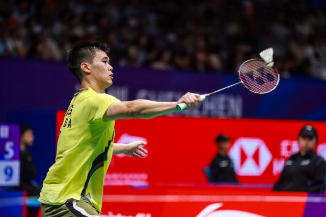 (260903) -- SHENZHEN, Sept. 3, 2026 (Xinhua) -- Brian Yang hits a return during the men's singles round of 16 match between Brian Yang of Canada and Naraoka Kodai of Japan at China Masters 2026 badminton tournament in Shenzhen, south China's Guangdong Province, Sept. 3, 2026. (Photo by Peng Zhigang/Xinhua)