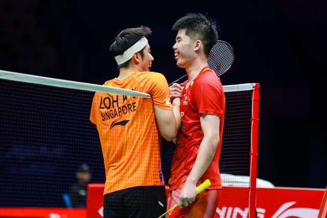 (260903) -- SHENZHEN, Sept. 3, 2026 (Xinhua) -- Loh Kean Yew (L) greets Weng Hongyang after the men's singles round of 16 match between Loh Kean Yew of Singapore and Weng Hongyang of China at China Masters 2026 badminton tournament in Shenzhen, south China's Guangdong Province, Sept. 3, 2026. (Photo by Peng Zhigang/Xinhua)