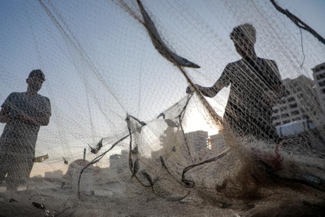 (260903) -- GAZA, Sept. 3, 2026 (Xinhua) -- Palestinian fishermen are seen working at Gaza's seaport, in Gaza City, on Sept. 3, 2026. (Photo by Rizek Abdeljawad/Xinhua)