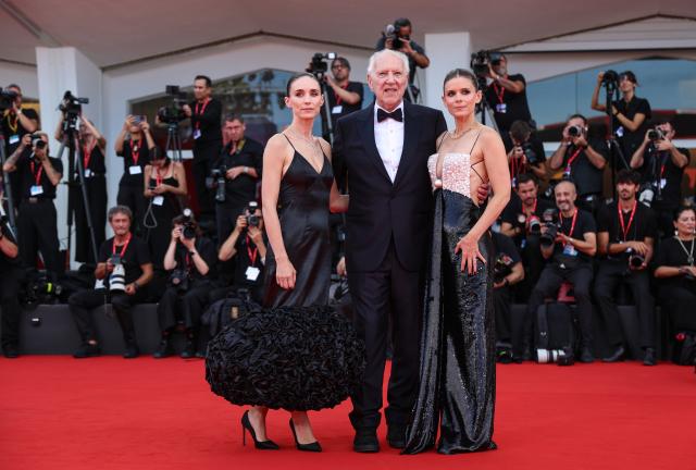 (260903) -- VENICE, Sept. 3, 2026 (Xinhua) -- German director Werner Herzog (C), American actress Kate Mara (R) and American actress Rooney Mara pose at the red carpet before the premiere of the film "Bucking Fastard" during the 83rd Venice International Film Festival in Venice, Italy, Sept. 3, 2026. (Xinhua/Wang Kaiyan)