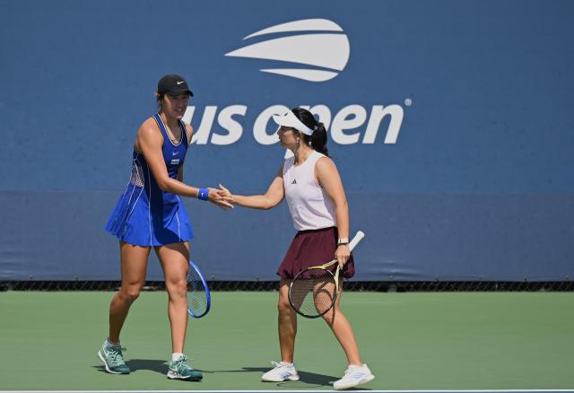 (260904) -- NEW YORK, Sept. 4, 2026 (Xinhua) -- Wang Xiyu (L)/Xu Yifan of China celebrate scoring during the women's doubles first round match between Wang Xiyu/Xu Yifan of China and Claire Liu/Julieta Pareja of the United States at the 2026 US Open tennis championships in New York, the United States, Sept. 3, 2026. (Xinhua/Li Rui)